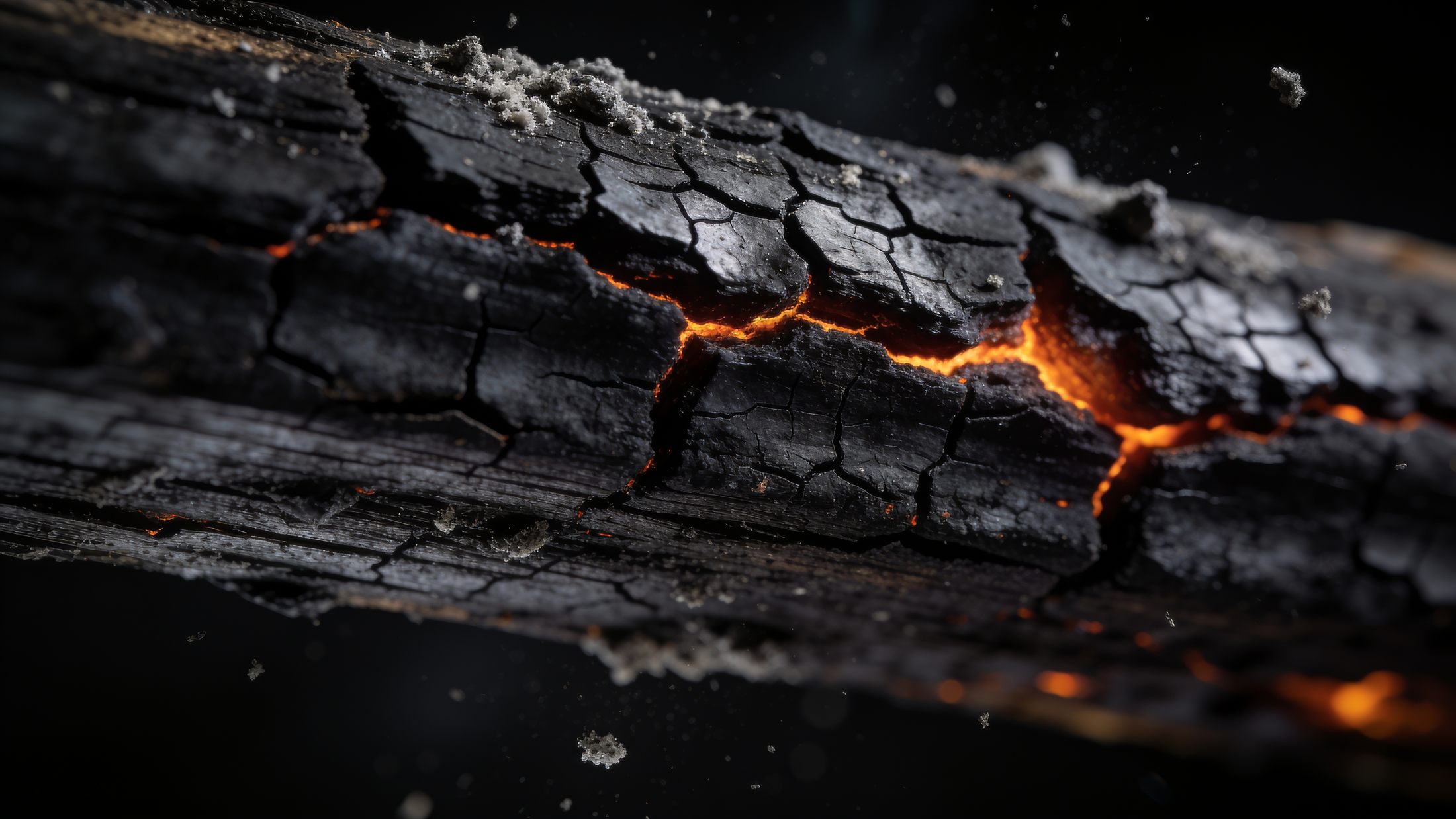 Close-up of charred material being treated